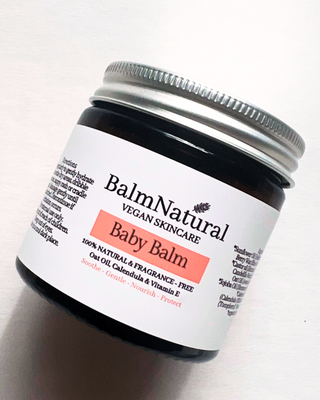 Jar of Vegan Baby Balm. Use ointment for baby's dry skin and nappy rash
