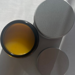 Lid open showing inside product, solid orange balm, Baby balm, balmnatural, soothe baby skin, soften, soothe nappy rash