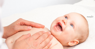 Baby massage with Baby balm helping baby relax for bed