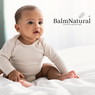 Baby, skincare for babies,  baby sitting on a bed