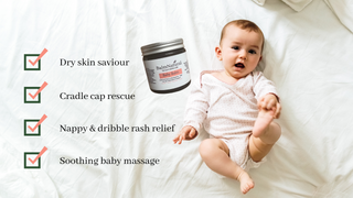 Baby on bed with BalmNatural Baby Balm Jar. Baby  Balm is ideal for dry skin, cradle cap rescue, nappy rash relief and baby massage